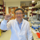 Hoon Sunwoo holds a sample of the antibody supplement he developed with colleague Jeong Sim.